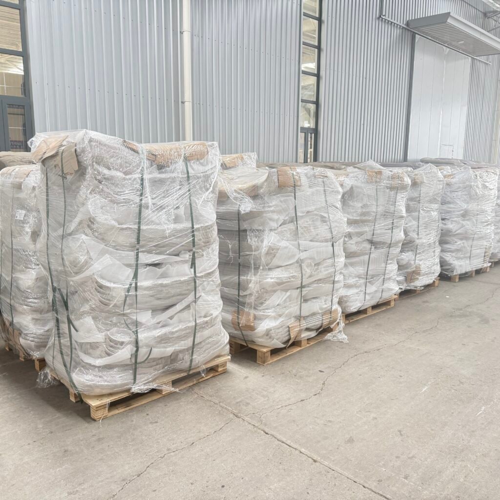 Electric tricycle CKD spare parts packed on wooden pallets with stretch wrap for export
